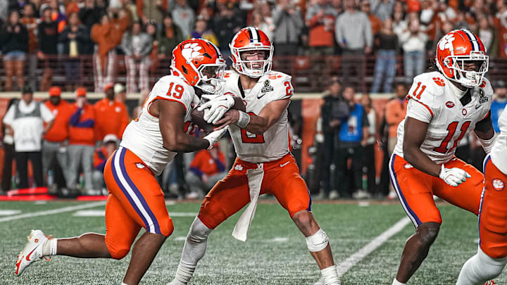 Clemson quarterback Cade Klubnik (2) hands the ball off to running back Keith Adams Jr. (19) during the game against the Texas Longhorns in the first round of the College Football Playoffs at Darrell K Royal-Texas Memorial Stadium on Saturday, Dec. 21, 2024.