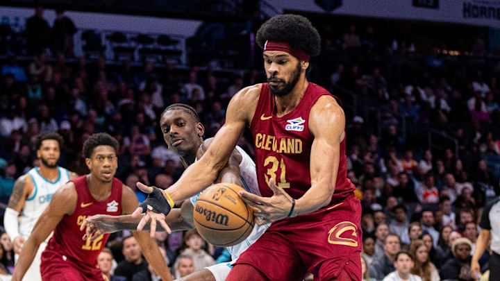 Mar 7, 2025; Charlotte, North Carolina, USA; Cleveland Cavaliers center Jarrett Allen (31) cuts off a pass to Charlotte Hornets forward Moussa Diabate (14) during the first quarter at Spectrum Center. Mandatory Credit: Scott Kinser-Imagn Images