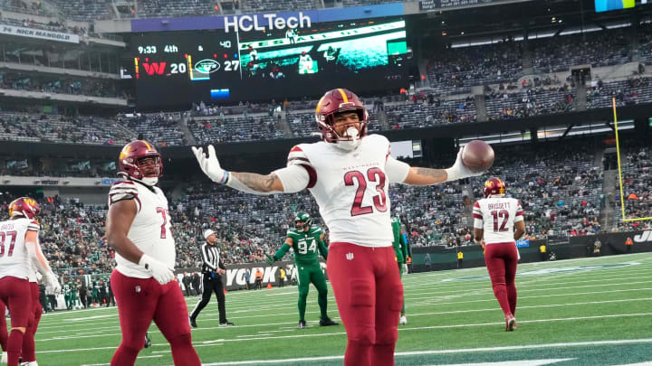 Dec 24, 2023; East Rutherford, New Jersey, USA; Washington Commanders running back Chris Rodriguez Jr. (23) celebrates a second half touchdown against the New York Jets at MetLife Stadium. Mandatory Credit: Robert Deutsch-USA TODAY Sports Dec 24, 2023; East Rutherford, New Jersey, USA; Washington Commanders running back Chris Rodriguez Jr. (23) celebrates a second half touchdown against the New York Jets at MetLife Stadium. Mandatory Credit: Robert Deutsch-USA TODAY Sports