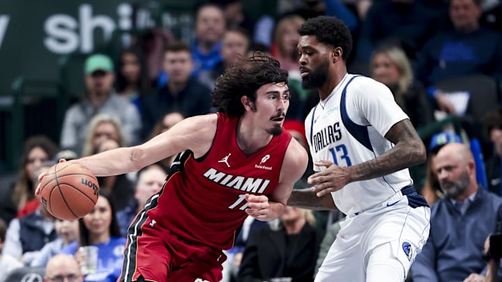 Feb 13, 2025; Dallas, Texas, USA;  Miami Heat guard Jaime Jaquez Jr. (11) drives to the basket as Dallas Mavericks forward Naji Marshall (13) defends during the first quarter at American Airlines Center. Mandatory Credit: Kevin Jairaj-Imagn Images