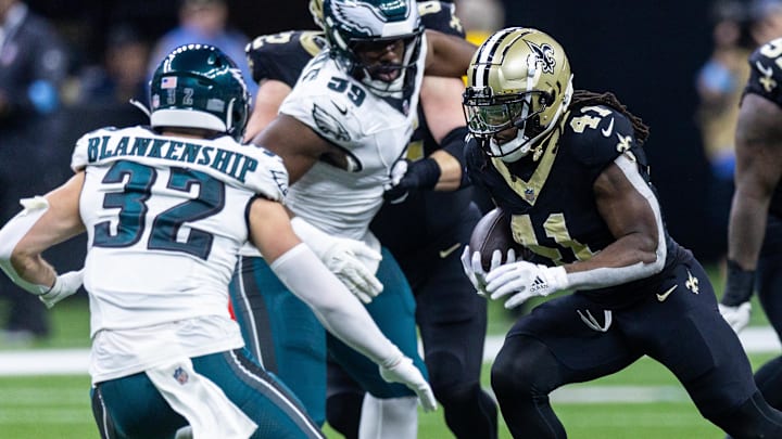 Sep 22, 2024; New Orleans, Louisiana, USA; New Orleans Saints running back Alvin Kamara (41) runs against Philadelphia Eagles safety Reed Blankenship (32) during the first half at Caesars Superdome. Mandatory Credit: Stephen Lew-Imagn Images