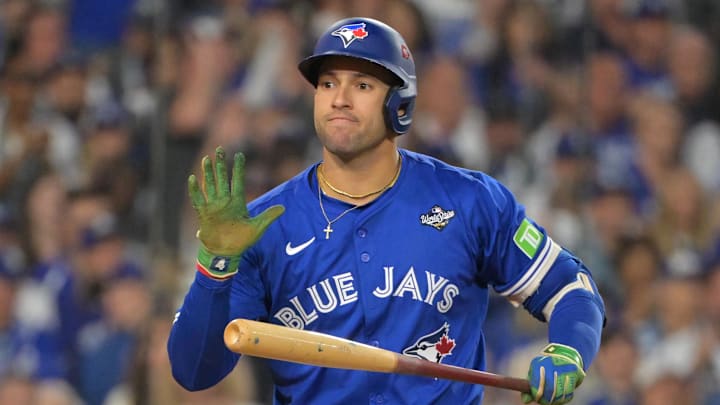 Oct 27, 2025; Los Angeles, California, USA; Toronto Blue Jays right fielder George Springer (4) reacts after striking out in the fourth inning against the Los Angeles Dodgers during game three of the 2025 MLB World Series at Dodger Stadium. 