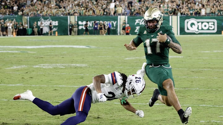 Byrum Brown ran for more than 100 yards and led USF to its fourth straight win Saturday over Florida Atlantic