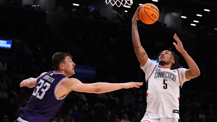 Mar 24, 2024; Brooklyn, NY, USA; Connecticut Huskies guard Stephon Castle (5) shoots the ball over