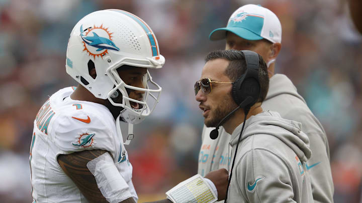 Dec 3, 2023; Landover, Maryland, USA; Miami Dolphins quarterback Tua Tagovailoa (1) talks with