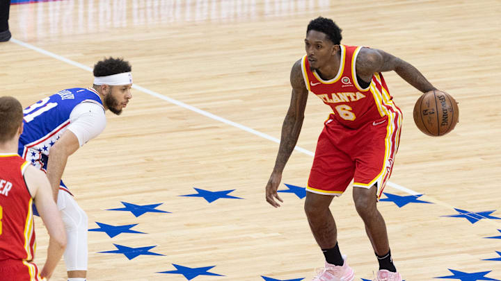 Jun 16, 2021; Philadelphia, Pennsylvania, USA; Atlanta Hawks guard Lou Williams (6) dribbles the ball against Philadelphia 76ers guard Seth Curry (31) during the fourth quarter in game five of the second round of the 2021 NBA Playoffs at Wells Fargo Center. Mandatory Credit: Bill Streicher-Imagn Images