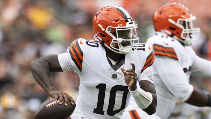 Cleveland Browns quarterback Tyler Huntley (10) runs the ball as he looks for an available receiver against the Green Bay Packers during the second quarter at Cleveland Browns Stadium this preseason.