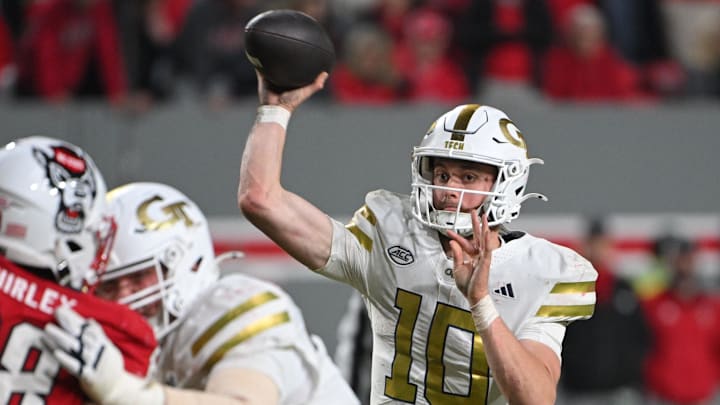 Nov 1, 2025; Raleigh, North Carolina, USA; Georgia Tech Yellow Jackets quarterback Haynes King (10) throws a pass in the fourth quarter against the NC State Wolfpack at Carter-Finley Stadium. Mandatory Credit: Zachary Taft-Imagn Images Nov 1, 2025; Raleigh, North Carolina, USA; Georgia Tech Yellow Jackets quarterback Haynes King (10) throws a pass in the fourth quarter against the NC State Wolfpack at Carter-Finley Stadium. Mandatory Credit: Zachary Taft-Imagn Images