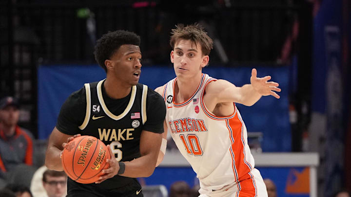 Mar 11, 2026; Charlotte, NC, USA; Wake Forest Demon Deacons guard Myles Colvin (6) with the ball as Clemson Tigers forward Jake Wahlin (10) defends in the second half at Spectrum Center. Mandatory Credit: Bob Donnan-Imagn Images