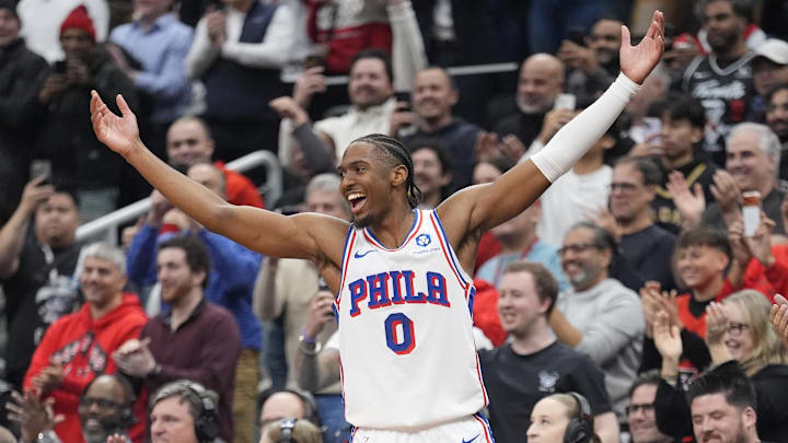 Jan 12, 2026; Toronto, Ontario, CAN; Philadelphia 76ers guard Tyrese Maxey (0) celebrates as guard Kyle Lowry (7) goes into the game against the Toronto Raptors during the second half at Scotiabank Arena. Mandatory Credit: John E. Sokolowski-Imagn Images