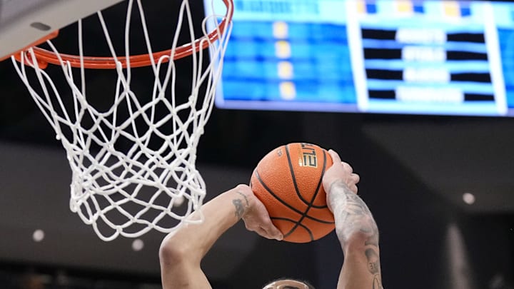Jan 7, 2025; Milwaukee, Wisconsin, USA;  Georgetown Hoyas guard-forward Micah Peavy (5) dunks during the first half against the Marquette Golden Eagles at Fiserv Forum. Mandatory Credit: Jeff Hanisch-Imagn Images
