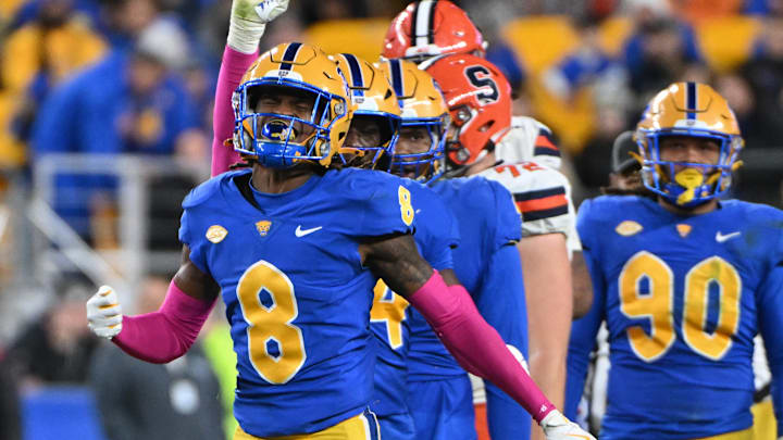 Oct 24, 2024; Pittsburgh, Pennsylvania, USA; Pittsburgh Panthers defensive back Tamon Lynum (8) celebrates a tackle of Syracuse Orange running back LeQuint Allen (1) during the third quarter at Acrisure Stadium. Mandatory Credit: Barry Reeger-Imagn Images