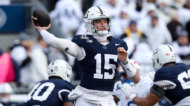 Dec 21, 2024; University Park, Pennsylvania, USA; Penn State Nittany Lions quarterback Drew Allar (15) throws a pass during the first quarter against the Southern Methodist Mustangs in the first round of the College Football Playoff at Beaver Stadium. Mandatory Credit: Matthew O'Haren-Imagn Images