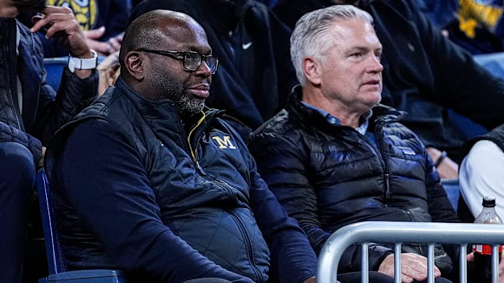 Michigan football running backs coach Tony Alford, left, and tight ends coach Freddie Whittingham, watch during the first half between Michigan and USC at Crisler Center in Ann Arbor on Friday, Jan. 2, 2026.