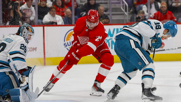 Dec 7, 2023; Detroit, Michigan, USA; Detroit Red Wings center Klim Kostin (24) scores a goal on San