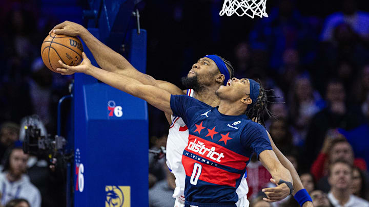 Jan 8, 2025; Philadelphia, Pennsylvania, USA; Philadelphia 76ers forward Guerschon Yabusele (28) blocks the shot of Washington Wizards guard Bilal Coulibaly (0) in the final minute the fourth quarter at Wells Fargo Center. Mandatory Credit: Bill Streicher-Imagn Images