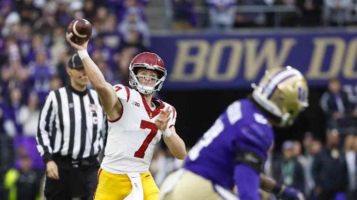 Nov 2, 2024; Seattle, Washington, USA; USC Trojans quarterback Miller Moss (7) passes against the Washington Huskies during the first quarter at Alaska Airlines Field at Husky Stadium. Mandatory Credit: Joe Nicholson-Imagn Images