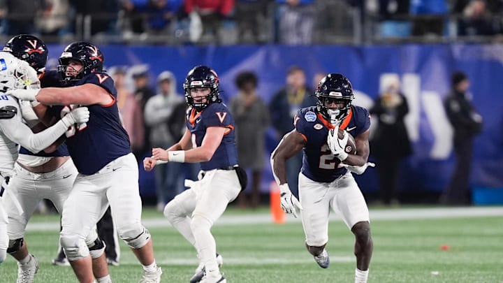 Dec 6, 2025; Charlotte, NC, USA; Virginia Cavaliers running back Harrison Waylee (21) runs with the ball in the second half against the Duke Blue Devils during the 2025 ACC Championship game at Bank of America Stadium. Mandatory Credit: Jim Dedmon-Imagn Images Dec 6, 2025; Charlotte, NC, USA; Virginia Cavaliers running back Harrison Waylee (21) runs with the ball in the second half against the Duke Blue Devils during the 2025 ACC Championship game at Bank of America Stadium. Mandatory Credit: Jim Dedmon-Imagn Images