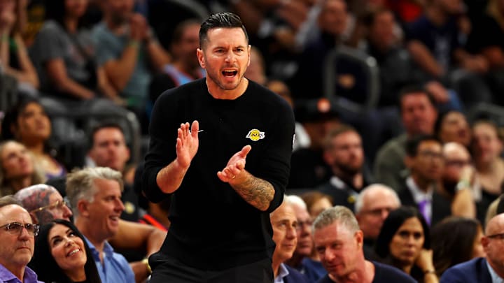 Los Angeles Lakers head coach JJ Redick cheers on his team during the second half against the Phoenix Suns at Footprint Center.