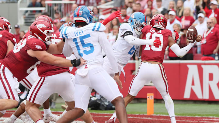 Nov 2, 2024; Fayetteville, Arkansas, USA; Arkansas Razorbacks quarterback Taylen Green (10) fumbles as he is hit by Ole Miss Rebels linebacker TJ Dottery (6) during the first quarter at Donald W. Reynolds Razorback Stadium. Mandatory Credit: Nelson Chenault-Imagn Images Nov 2, 2024; Fayetteville, Arkansas, USA; Arkansas Razorbacks quarterback Taylen Green (10) fumbles as he is hit by Ole Miss Rebels linebacker TJ Dottery (6) during the first quarter at Donald W. Reynolds Razorback Stadium. Mandatory Credit: Nelson Chenault-Imagn Images