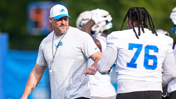 Detroit Lions head coach Dan Campbell fist bumps defensive end Raequan Williams (76) during training camp at Meijer Performance Center in Allen Park on Sunday, July 20, 2025.