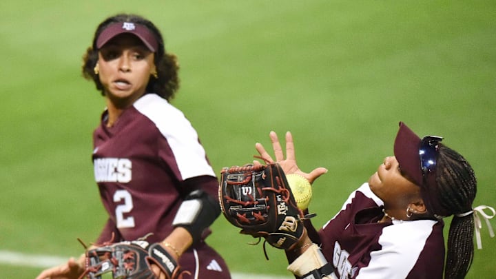April 15, 2024; Tuscaloosa, AL, USA; Texas A&M third baseman Kennedy Powell snags a fly ball in foul territory over her shoulder as shortstop Rylen Wiggins backs her up during the game with Alabama at Rhoads Stadium Monday. April 15, 2024; Tuscaloosa, AL, USA; Texas A&M third baseman Kennedy Powell snags a fly ball in foul territory over her shoulder as shortstop Rylen Wiggins backs her up during the game with Alabama at Rhoads Stadium Monday.