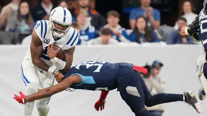Tennessee Titans cornerback Darrell Baker Jr. (39) tackles Indianapolis Colts quarterback Anthony Richardson (5) on Sunday, Dec. 22, 2024, during a game against the Tennessee Titans at Lucas Oil Stadium in Indianapolis. Tennessee Titans cornerback Darrell Baker Jr. (39) tackles Indianapolis Colts quarterback Anthony Richardson (5) on Sunday, Dec. 22, 2024, during a game against the Tennessee Titans at Lucas Oil Stadium in Indianapolis.