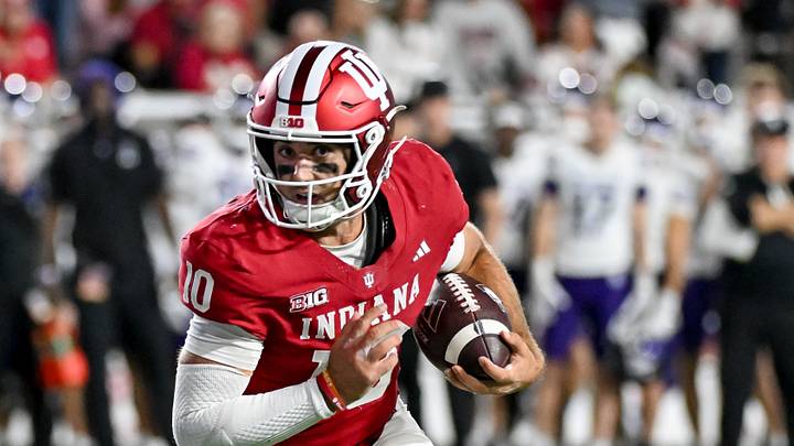 Sep 25, 2026; Bloomington, Indiana, USA; Indiana Hoosiers quarterback Josh Hoover (10) runs for a touchdown against the Northwestern Wildcats during the second half at Merchants Bank Field at Memorial Stadium. Mandatory Credit: Robert Goddin-Imagn Images Sep 25, 2026; Bloomington, Indiana, USA; Indiana Hoosiers quarterback Josh Hoover (10) runs for a touchdown against the Northwestern Wildcats during the second half at Merchants Bank Field at Memorial Stadium. Mandatory Credit: Robert Goddin-Imagn Images