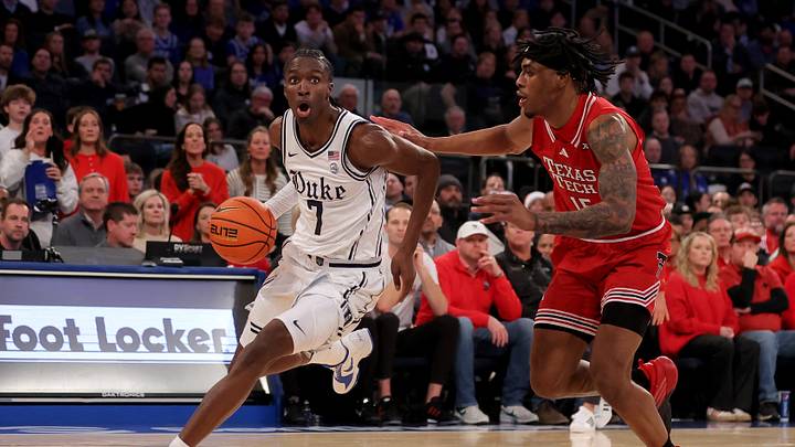 Dec 20, 2025; New York, New York, USA; Duke Blue Devils guard Dame Sarr (7) drives to the basket against Texas Tech Red Raiders forward JT Toppin (15) during the first half at Madison Square Garden. Mandatory Credit: Brad Penner-Imagn Images Dec 20, 2025; New York, New York, USA; Duke Blue Devils guard Dame Sarr (7) drives to the basket against Texas Tech Red Raiders forward JT Toppin (15) during the first half at Madison Square Garden. Mandatory Credit: Brad Penner-Imagn Images