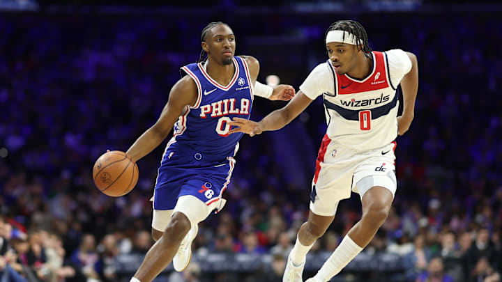 Jan 7, 2026; Philadelphia, Pennsylvania, USA; Philadelphia 76ers guard Tyrese Maxey (0) dribbles the ball past Washington Wizards guard Bilal Coulibaly (0) during the third quarter at Xfinity Mobile Arena. Mandatory Credit: Bill Streicher-Imagn Images