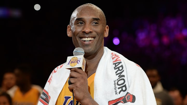 Apr 13, 2016; Los Angeles, CA, USA; Los Angeles Lakers forward Kobe Bryant (24) smiles as he addresses the crowd after the Lakers defeat of the Utah Jazz in the final game of his career at Staples Center. Mandatory Credit: Robert Hanashiro-Imagn Images