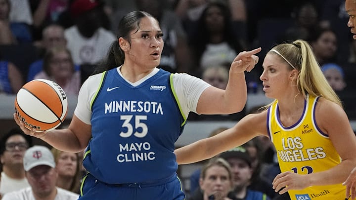 Jun 21, 2025; Minneapolis, Minnesota, USA; Minnesota Lynx forward Alissa Pili (35) works around Los Angeles Sparks guard Sarah Ashlee Barker (13) in the first quarter at Target Center. Mandatory Credit: Bruce Kluckhohn-Imagn Images