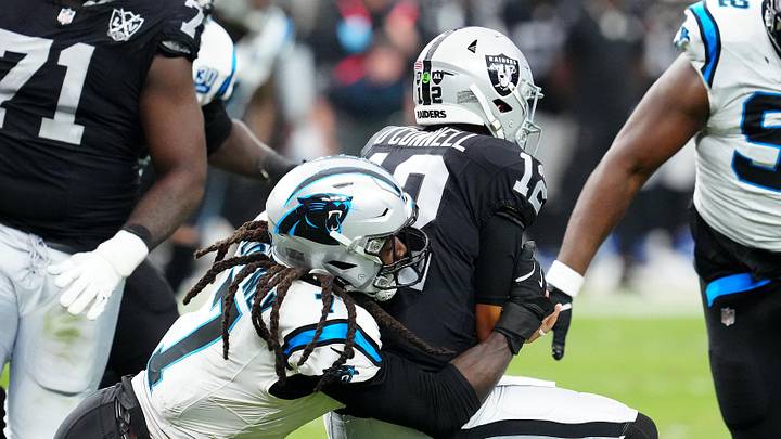 Sep 22, 2024; Paradise, Nevada, USA; Carolina Panthers linebacker Jadeveon Clowney (7) sacks Las Vegas Raiders quarterback Aidan O'Connell (12) during the fourth quarter at Allegiant Stadium. Mandatory Credit: Stephen R. Sylvanie-Imagn Images