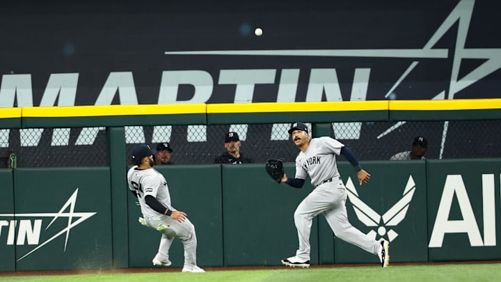 Aug 5, 2025; Arlington, Texas, USA; New York Yankees center fielder Trent Grisham (12) makes a catch in front of New York Yankees left fielder Jasson Dominguez (24) during the seventh inning against the Texas Rangers at Globe Life Field. Mandatory Credit: Kevin Jairaj-Imagn Images Aug 5, 2025; Arlington, Texas, USA; New York Yankees center fielder Trent Grisham (12) makes a catch in front of New York Yankees left fielder Jasson Dominguez (24) during the seventh inning against the Texas Rangers at Globe Life Field. Mandatory Credit: Kevin Jairaj-Imagn Images