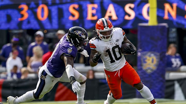 Sep 14, 2025; Baltimore, Maryland, USA; Cleveland Browns running back Quinshon Judkins (10) runs the ball against Baltimore Ravens linebacker Roquan Smith (0) during the fourth quarter at M&T Bank Stadium. Mandatory Credit: Peter Casey-Imagn Images
