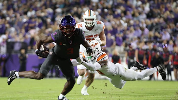 Nov 9, 2024; Fort Worth, Texas, USA; TCU Horned Frogs wide receiver Savion Williams (3) is tackled by Oklahoma State Cowboys safety Dylan Smith (11) in the second quarter at Amon G. Carter Stadium. Mandatory Credit: Tim Heitman-Imagn Images Nov 9, 2024; Fort Worth, Texas, USA; TCU Horned Frogs wide receiver Savion Williams (3) is tackled by Oklahoma State Cowboys safety Dylan Smith (11) in the second quarter at Amon G. Carter Stadium. Mandatory Credit: Tim Heitman-Imagn Images
