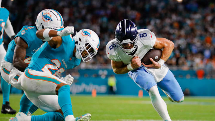 Tennessee Titans quarterback Will Levis (8) runs with the football as Miami Dolphins safety Brandon Jones (29) prepares to make a tackle during the second quarter at Hard Rock Stadium last December.