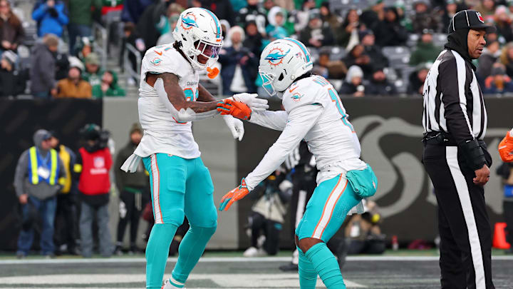 Miami Dolphins running back Ollie Gordon II (31) celebrates after scoring a touchdown against the New York Jets during the second half at MetLife Stadium.
