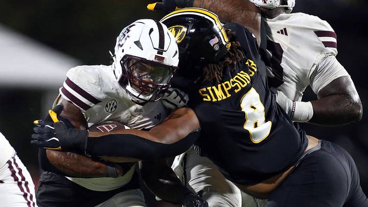 Sep 26, 2026; Starkville, Mississippi, USA; Mississippi State Bulldogs running back Fluff Bothwell (24) runs the ball as Missouri Tigers defensive tackle Donta Simpson (8) attempts to make the tackle during the third quarter at Davis Wade Stadium at Scott Field. Mandatory Credit: Petre Thomas-Imagn Images Sep 26, 2026; Starkville, Mississippi, USA; Mississippi State Bulldogs running back Fluff Bothwell (24) runs the ball as Missouri Tigers defensive tackle Donta Simpson (8) attempts to make the tackle during the third quarter at Davis Wade Stadium at Scott Field. Mandatory Credit: Petre Thomas-Imagn Images