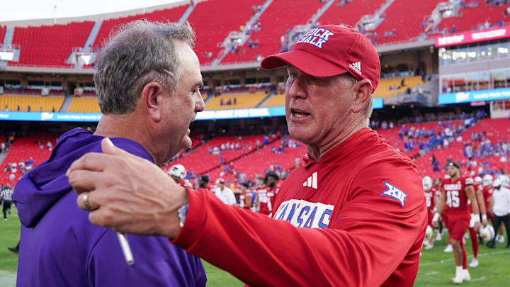 Sep 28, 2024; Kansas City, Missouri, USA; TCU Horned Frogs head coach Sonny Dykes talks with Kansas Jayhawks head coach Lance Leipold after the game at GEHA Field at Arrowhead Stadium.