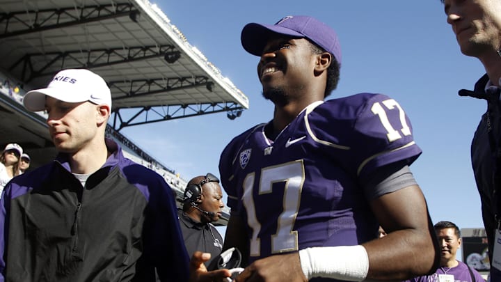  Huskies quarterback Keith Price (17) leaves the field after a 56-0 victory over Idaho State in 2013.