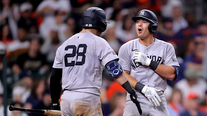 Mar 30, 2024; Houston, Texas, USA; New York Yankees shortstop Anthony Volpe (11) is congratulated by New York Yankees catcher Austin Wells (28) after hitting a home run against the Houston Astros during the eighth inning at Minute Maid Park. Mandatory Credit: Erik Williams-Imagn Images
