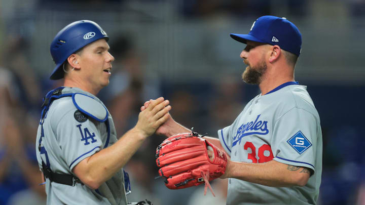 May 5, 2025; Miami, Florida, USA; Los Angeles Dodgers relief pitcher Kirby Yates (38) celebrates with catcher Will Smith (16) after the game against the Miami Marlins at loanDepot Park. Mandatory Credit: Sam Navarro-Imagn Images