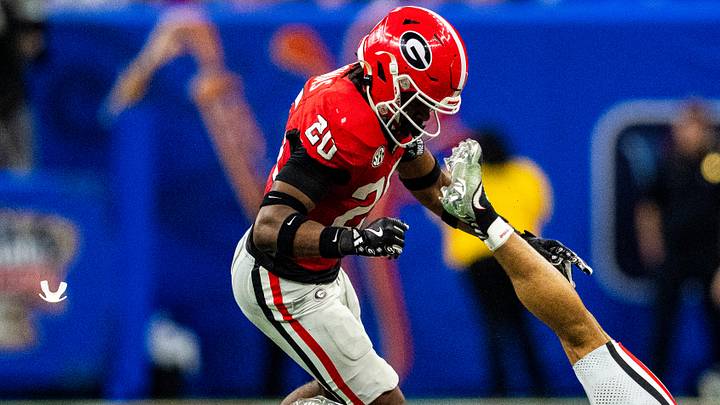 A mouthguard flies through the air after Georgia defensive back JaCorey Thomas (20) hits Ole Miss wide receiver Cayden Lee (19) to the ground during the Sugar Bowl and College Football Playoff quarterfinals at Caesars Superdome in New Orleans, La., on Thursday, Jan. 1, 2026. Ole Miss defeated Georgia 39-34. Thomas was called for targeting and ejected from the game.