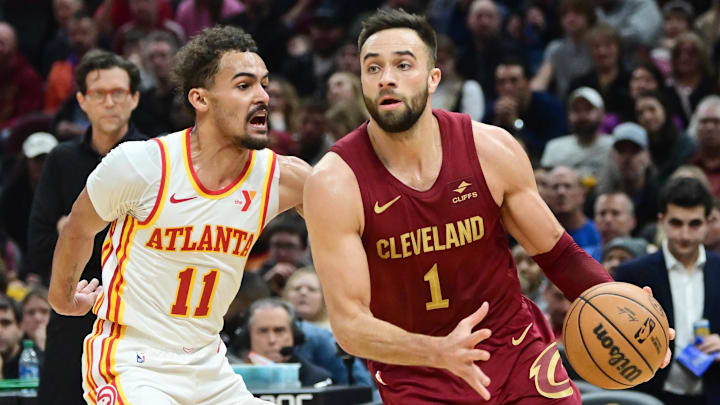 Cavaliers guard Max Strus (1) drives against Hawks guard Trae Young (11) during the second half in Cleveland. 