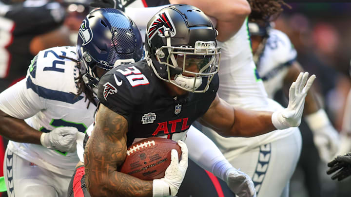 Oct 20, 2024; Atlanta, Georgia, USA; Atlanta Falcons running back Jase McClellan (30) runs the ball against the Seattle Seahawks in the fourth quarter at Mercedes-Benz Stadium. Mandatory Credit: Brett Davis-Imagn Images
