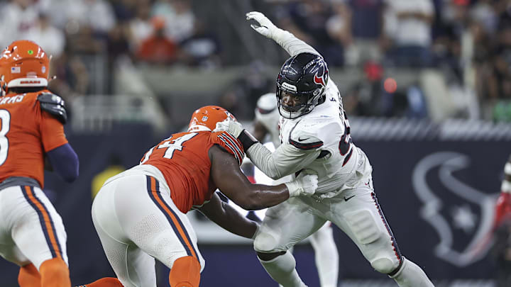 Sep 15, 2024; Houston, Texas, USA; Chicago Bears guard Nate Davis (64) attempts to block Houston Texans defensive tackle Khalil Davis (94) during the game at NRG Stadium. Mandatory Credit: Troy Taormina-Imagn Images
