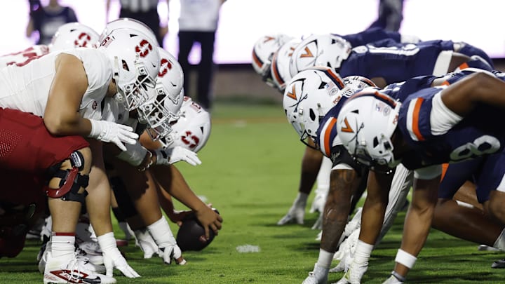Sep 20, 2025; Charlottesville, Virginia, USA; The Stanford Cardinal offense lines up for an extra point conversion against the Virginia Cavaliers defense during the first quarter at Scott Stadium. Mandatory Credit: Geoff Burke-Imagn Images