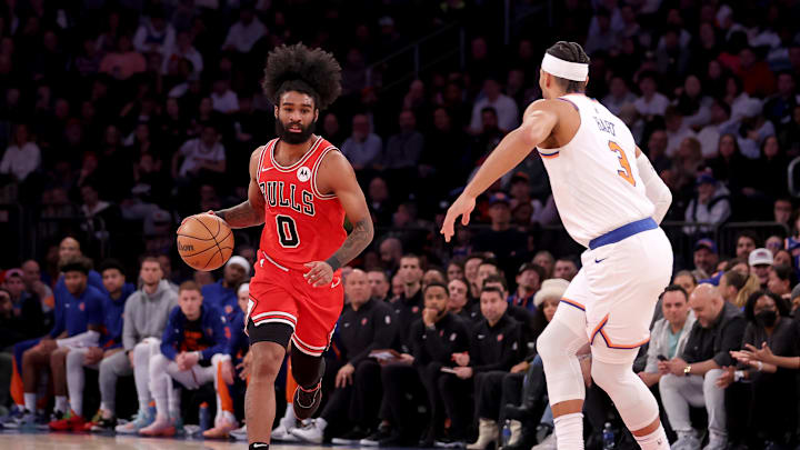 Jan 3, 2024; New York, New York, USA; Chicago Bulls guard Coby White (0) brings the ball up court against New York Knicks guard Josh Hart (3) during the fourth quarter at Madison Square Garden. Mandatory Credit: Brad Penner-Imagn Images
