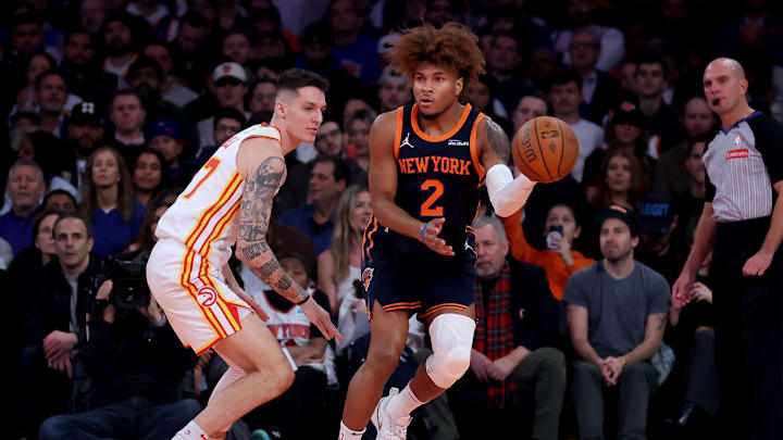 Dec 11, 2024; New York, New York, USA; New York Knicks guard Miles McBride (2) looks to pass the ball against Atlanta Hawks guard Vit Krejci (27) during the second quarter at Madison Square Garden. Mandatory Credit: Brad Penner-Imagn Images